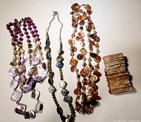 Overview of three shell necklaces and shell bracelet