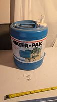 Front view showing Reliance Water-Pak label and overall jug