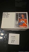 Closed white card storage box labelled 2021-22 Upper Deck Extended (501-700) with visible sample Connor McDavid card