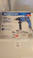 Front of sealed Mastercraft hammer drill retail box showing drill, accessories and specifications