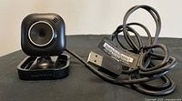 Front view of webcam with attached USB cable
