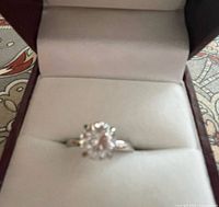 Ring in box showing high-set round CZ stone