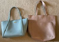 Front view of Roots tan tote and Pink Lottie light blue tote