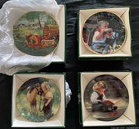 Four Zolan mini plates in boxes showing artwork