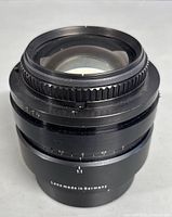 Close-up of the front and part of the barrel of the TCD 1032 f/1.14 lens showing the glass element and focus ring.