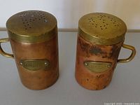 Pair of copper salt and pepper shakers