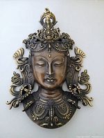 Front view of ornate bronze-finished Tara plaque