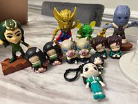 Group shot of Marvel, Demon Slayer and keychain figures