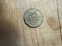 Obverse of single 20 Céntimos coin showing national arms