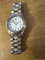 Front view of Pulsar two-tone stainless steel watch showing dial and bracelet