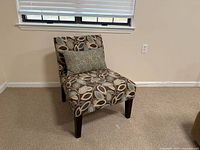Full view of accent chair against wall