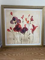 Front view of framed floral canvas painting