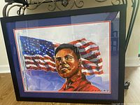 Full view of framed Penley print on floor