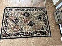 Full view of entire rug on wood floor