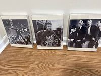Front view of all three framed photographs standing side by side