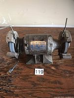 Front view showing full grinder with dual wheels, cord and overall wear