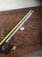 Full view of 33.5 in propane torch with tape measure for length reference