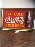 Front view of rectangular Coca-Cola wooden sign with measuring tape showing dimensions
