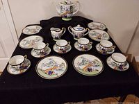 Complete tea set laid out on table showing all pieces