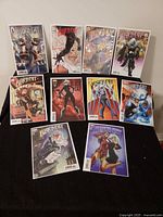 All ten bagged and boarded Black Cat comics displayed on table