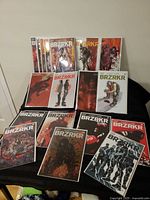 All 14 BRZRKR comic books displayed in protective bags and boards