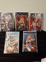 Front view of all five bagged comics