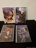 All four Draculina Blood Simple comic books bagged and boarded displayed on flat surface