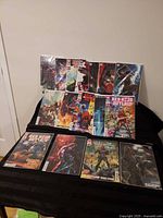 Front view showing all sixteen Red Hood Outlaw comic issues laid out in two rows