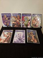 All seven bagged & boarded Draculina comics arranged on table showing covers