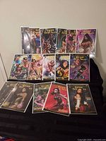 All 16 bagged Grimm Fairy Tales comics displayed on black surface