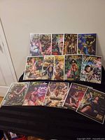 All fourteen bagged Grimm Fairy Tales issues arranged on table