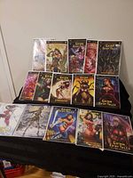 All thirteen comic books bagged and boarded laid out