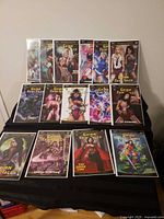 All thirteen Grimm Fairy Tales comics laid out on black surface