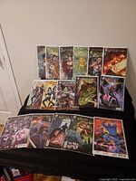 All sixteen bagged issues laid out on black surface