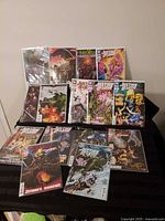 All 15 Justice League issues displayed in protective bags and boards