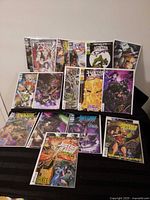 All fourteen bagged Justice League comics spread out to show covers and confirm issue range