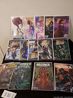 All eleven bagged comics laid out in three rows