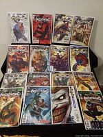 All 16 bagged & boarded Nightwing comic books laid out for view