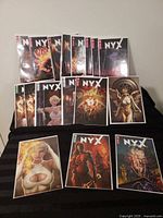 Front view of all eleven bagged NYX comics showing issue numbers and variant covers