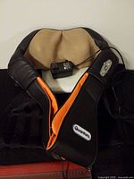Full view of Quantum heated neck massager with power adapter