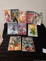 Front view showing 11 of the bagged comics laid out