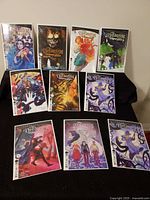 All ten bagged and boarded issues laid out on a black surface