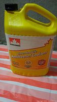 Front view of yellow Petro-Canada Extended Life Antifreeze/Coolant jug