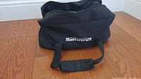 Exterior of black nylon Mastercraft case showing logo and handles