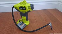 Front side of Ryobi ONE+ inflator with hose attached
