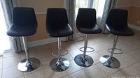 Front view of four bar stools