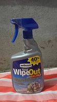 Front view of sealed Wilson Total WipeOut Ultra 1 L spray bottle