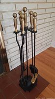 Full view of fireplace tool set on stand