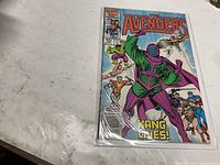 Front cover of The Avengers #267 comic in bag and board