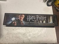 Closed branded box top with Harry Potter graphics